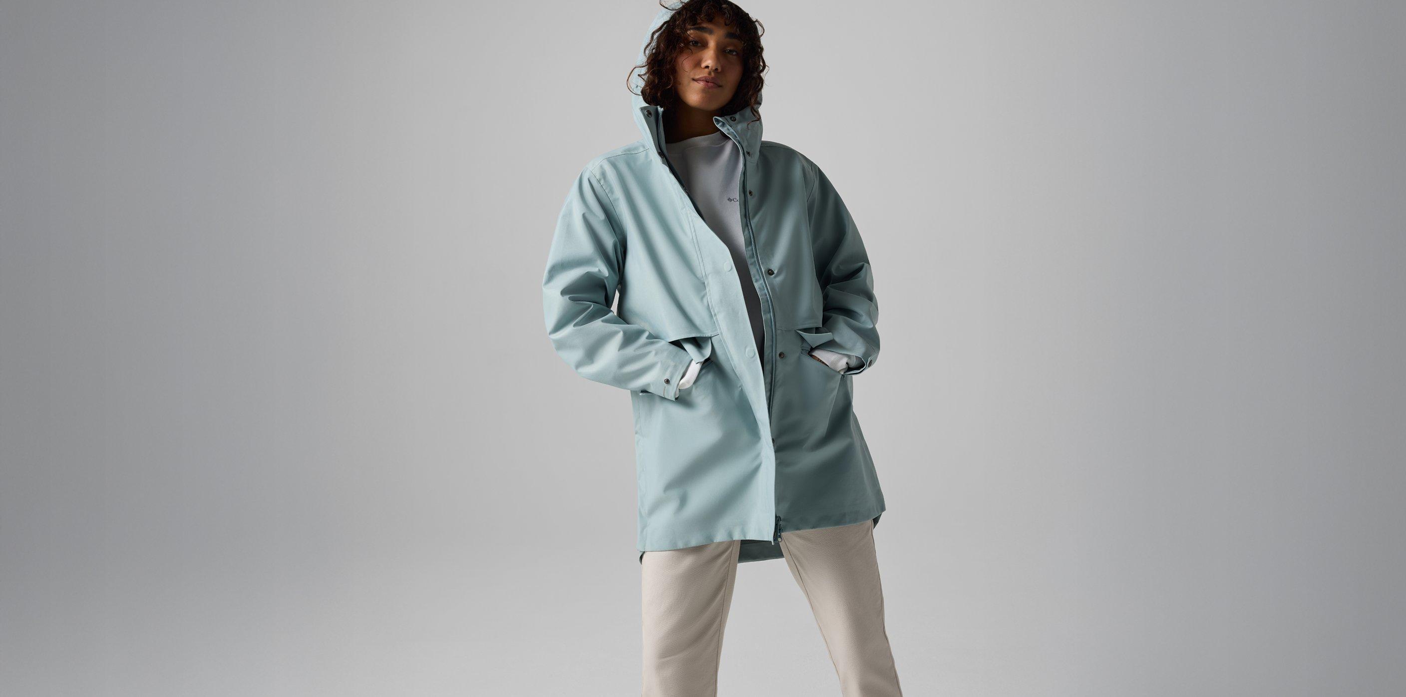 A women wearing a blue rain jacket