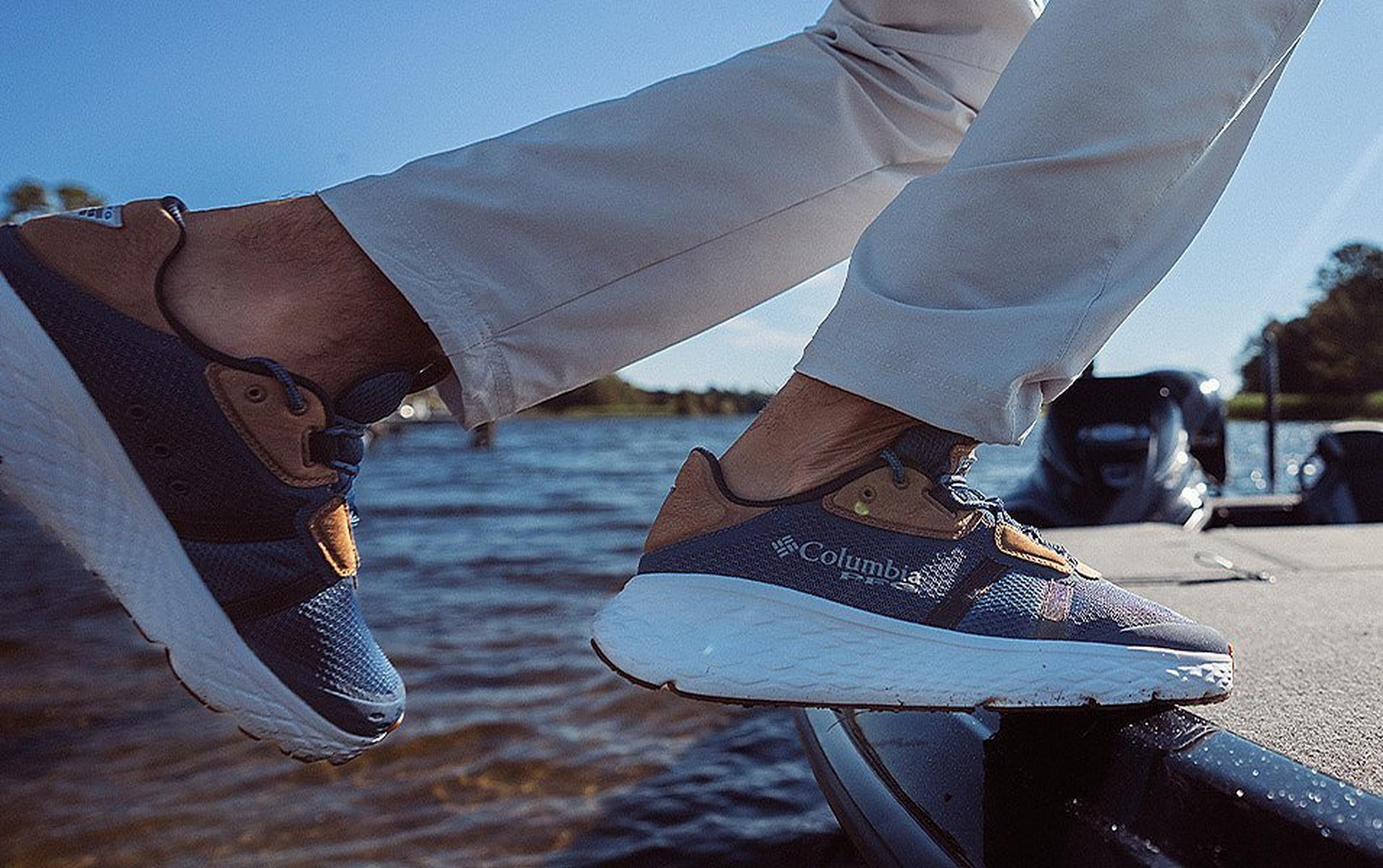 Close up of a person's shoes as the hop onto the edge of a boat