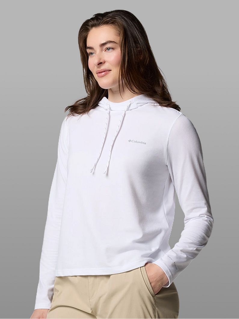 A woman wearing a white hoodie.