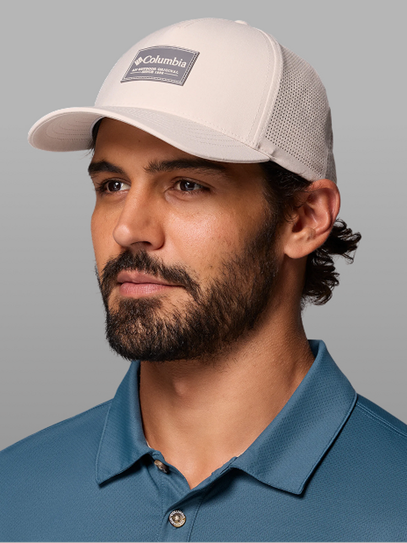 A man wearing a white ball cap.