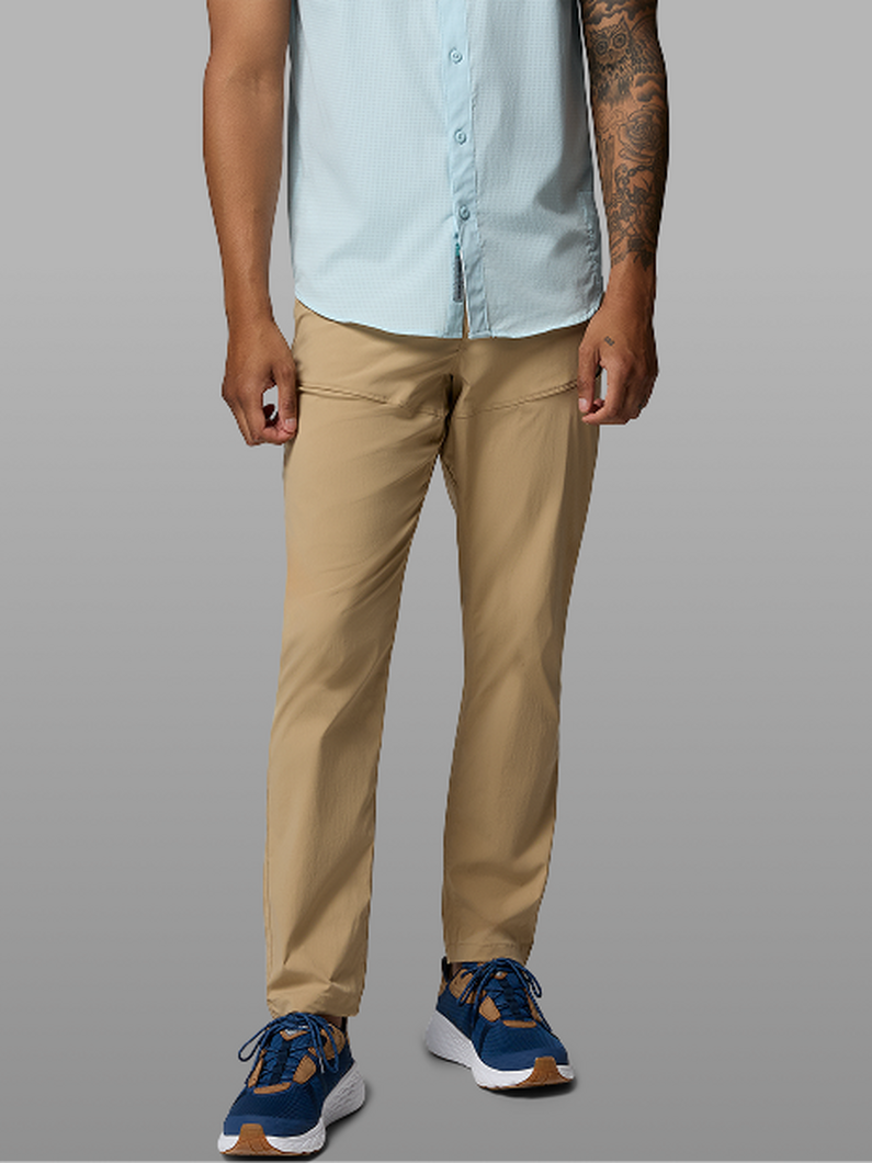 Waist-down image of a man wearing tan pants.