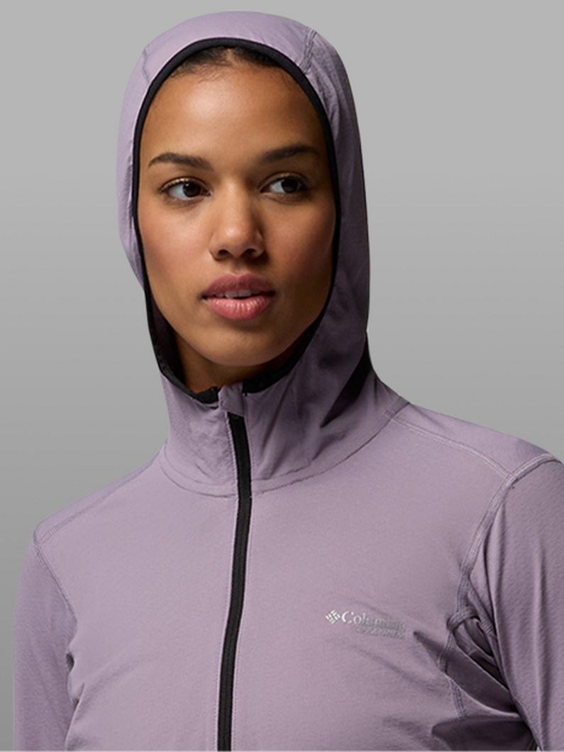 A woman wearing a purple hoodie.