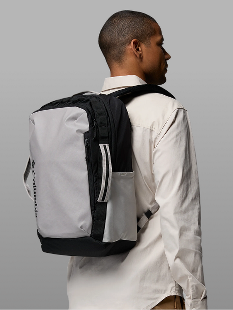 A man wearing a blue backpack.