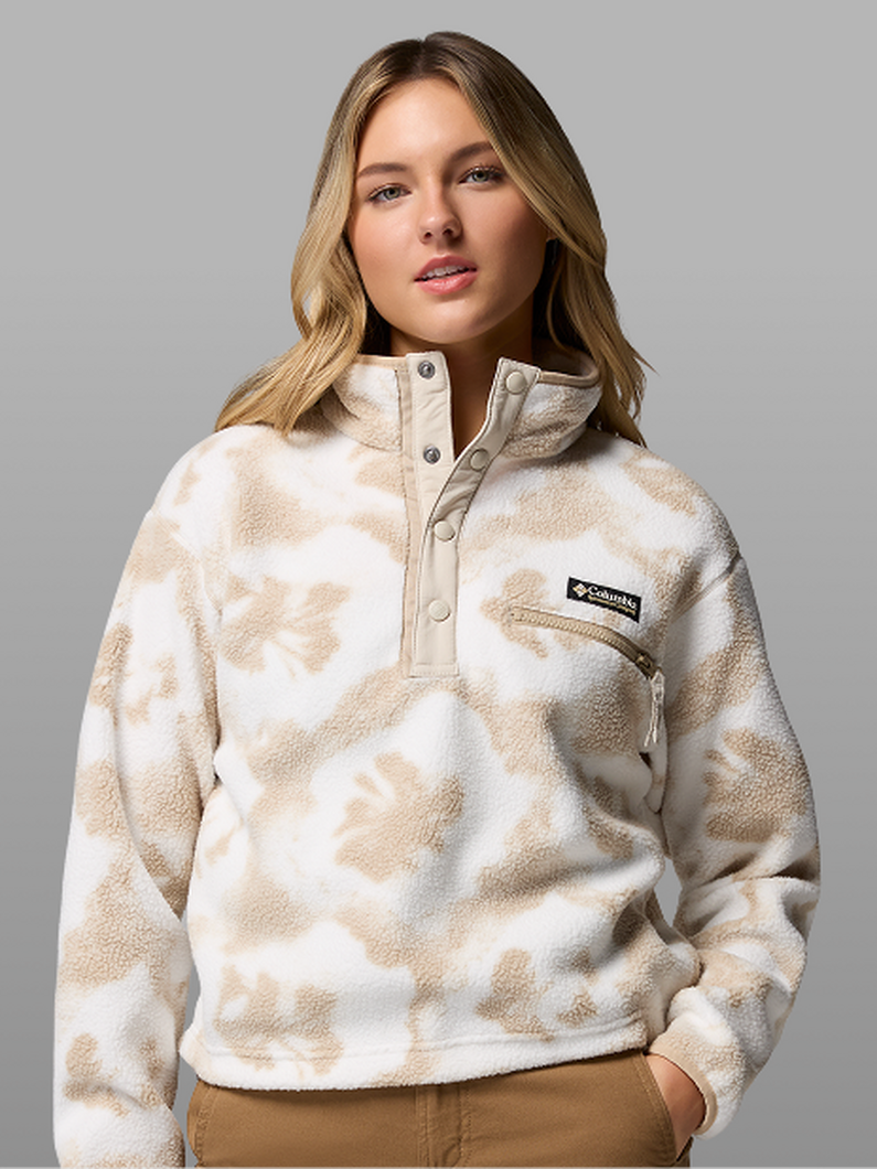 A woman wearing a beige fleece pullover.