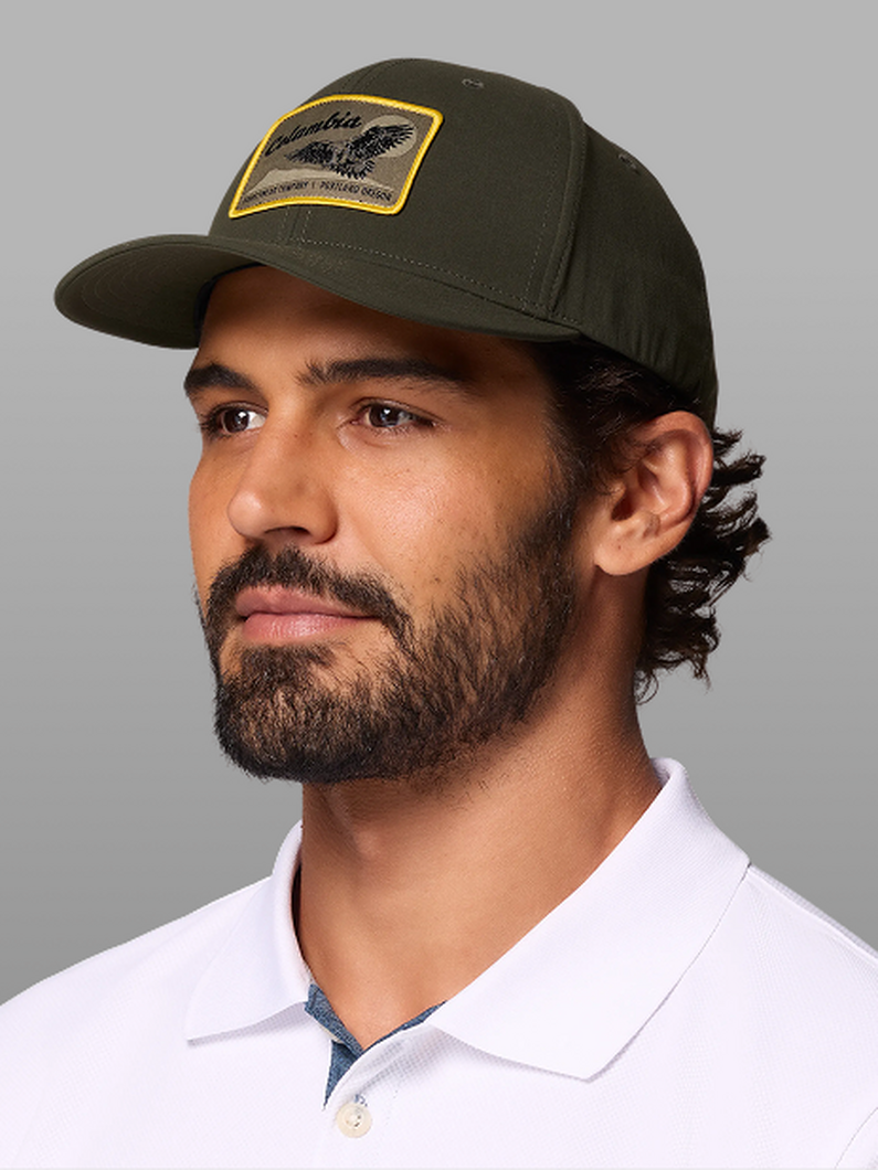 A man wearing a dark green ball cap.