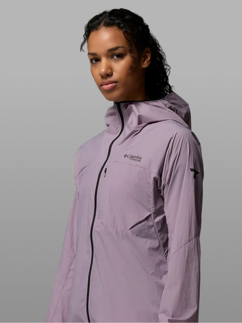 A woman wearing a purple rain jacket.