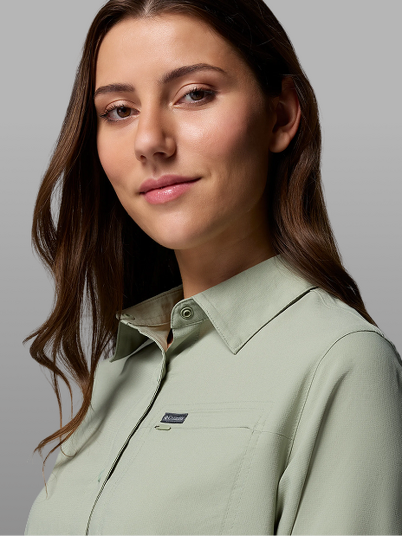 A woman wearing a green shirt.