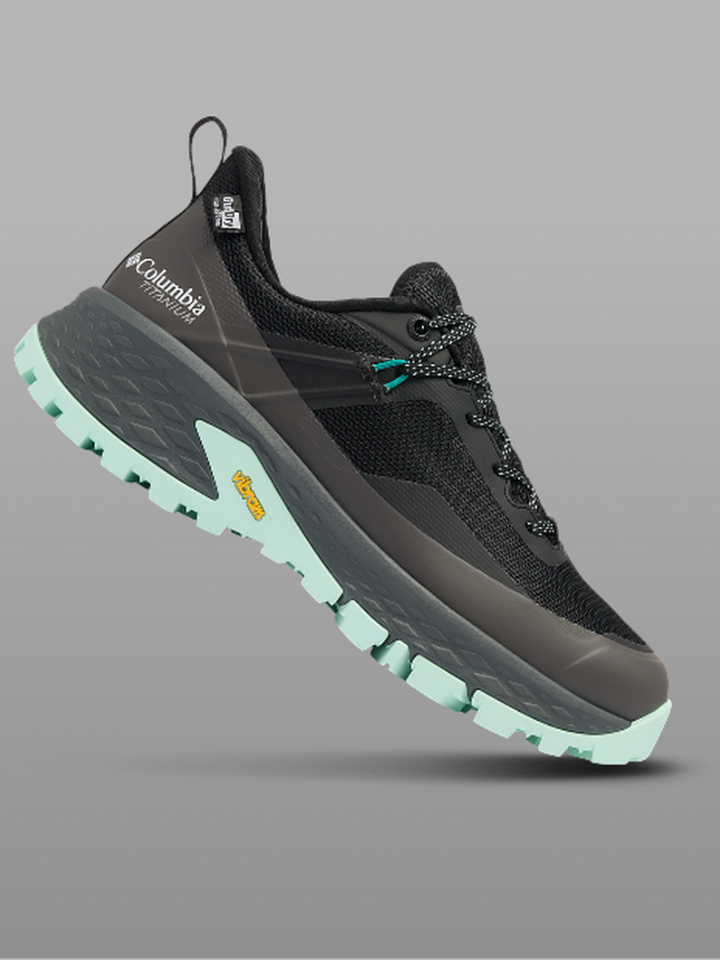 A black and teal hiking shoe.