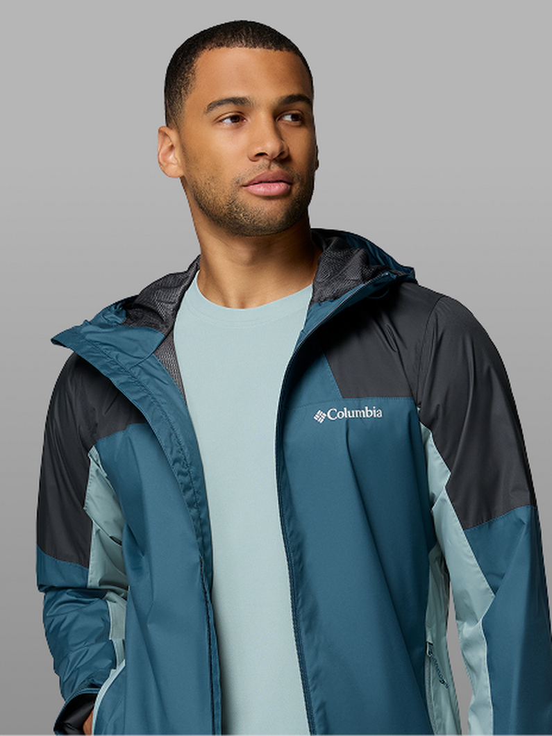 A man wearing a blue rain jacket.