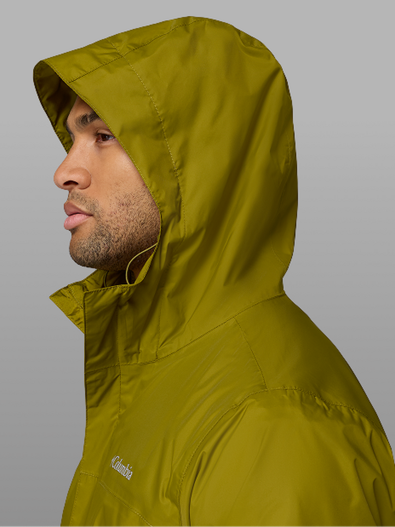 A man wearing a green rain jacket.