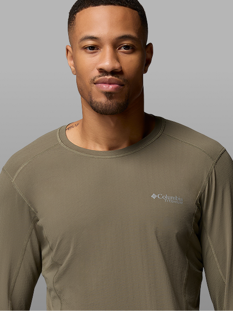 A man wearing a green long-sleeved shirt.