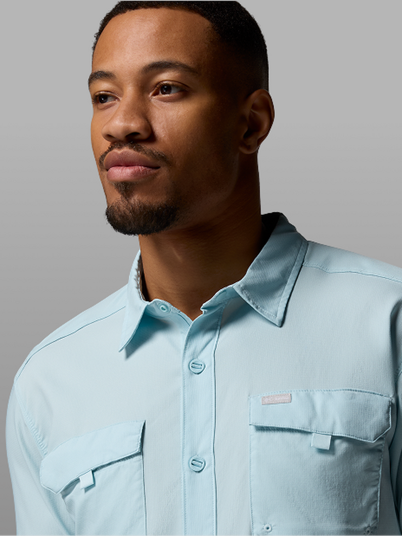 A man wearing a light blue button-up.