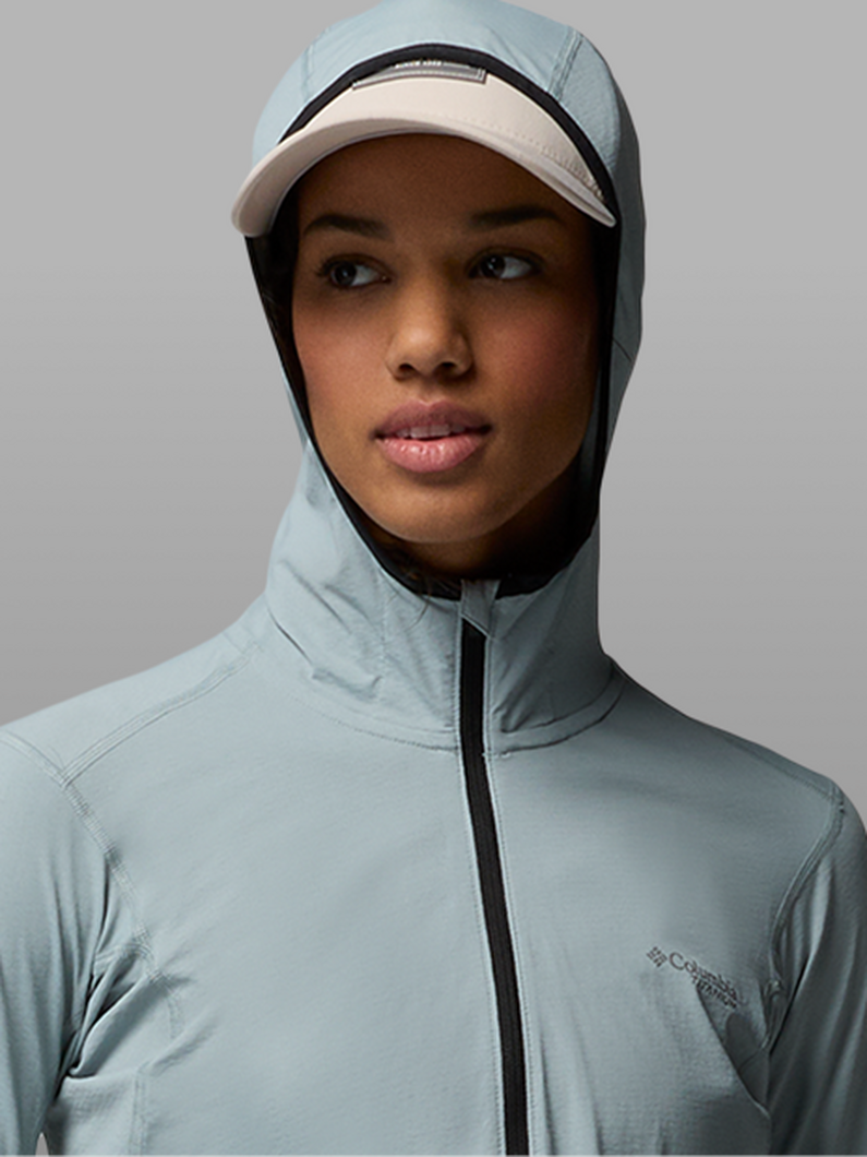 A woman wearing a blue hoodie.