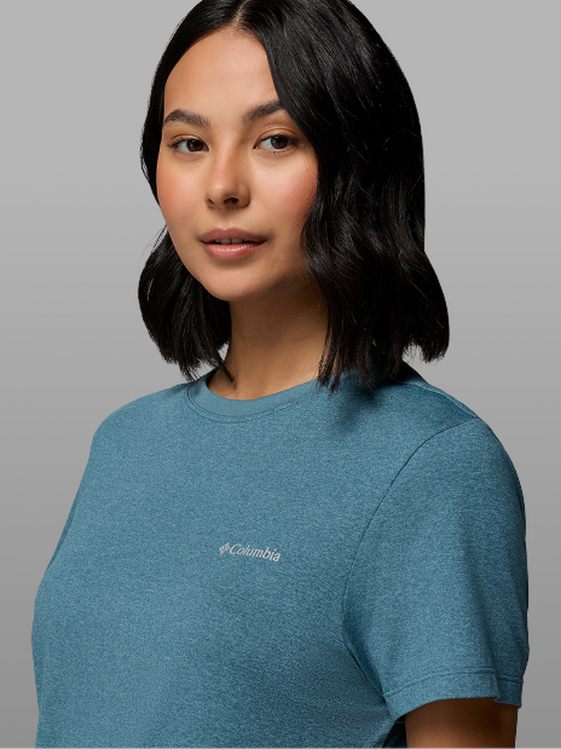 A woman wearing a blue t-shirt.