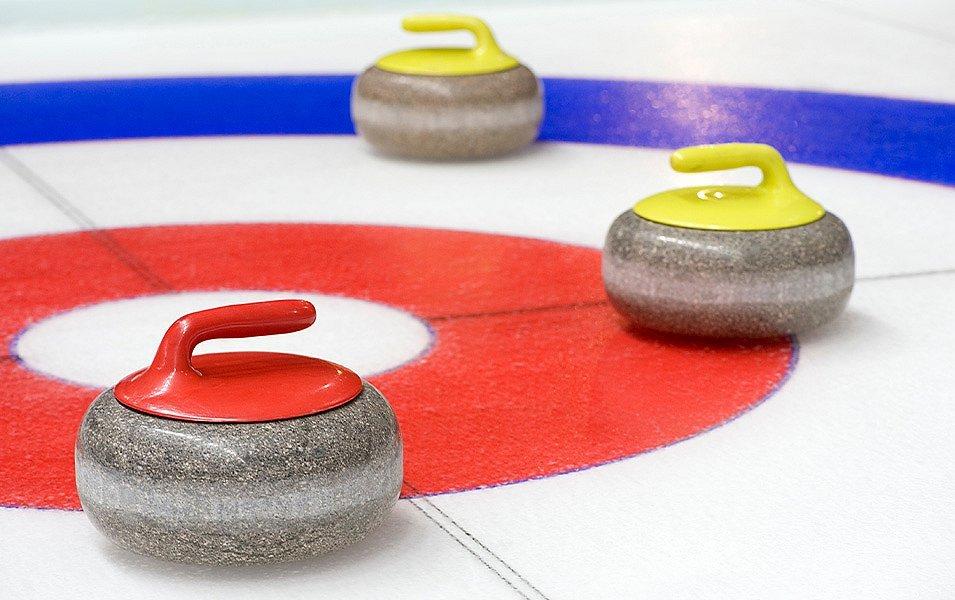 Three stones are near the Button, which is the center of the curling target. 