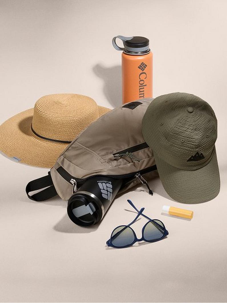 Outdoor accessories including straw sun hat, olive cap, orange water bottle, tan crossbody bag, binoculars, and sunglasses.