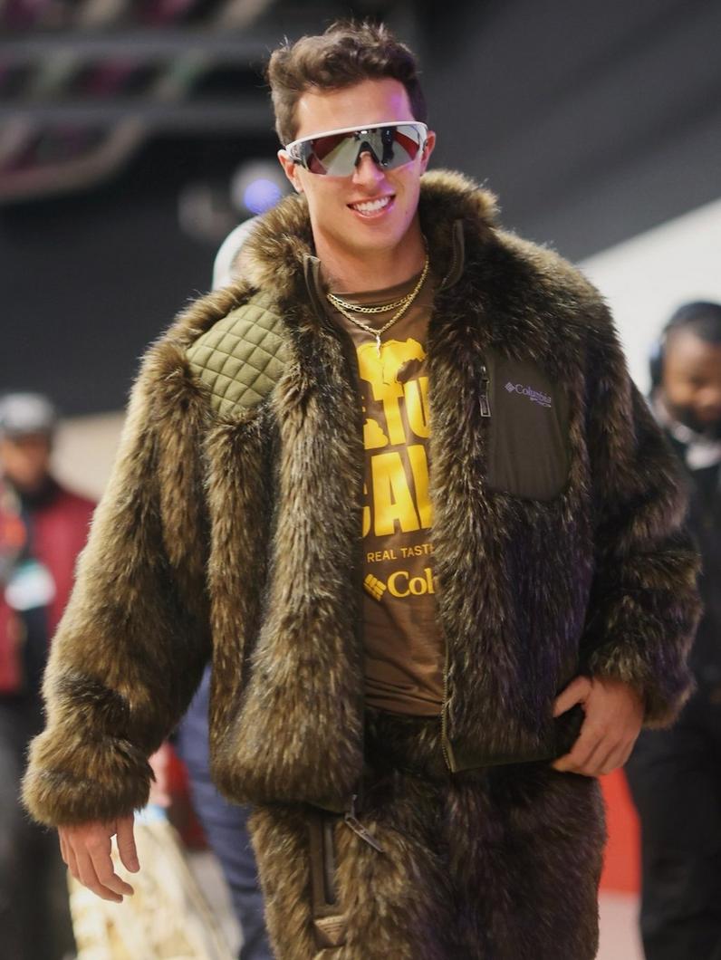 NFL quarterback Tommy DeVito wearing a Nature Calls tee and bear-inspired Columbia Performance Hunting Gear from the archives.