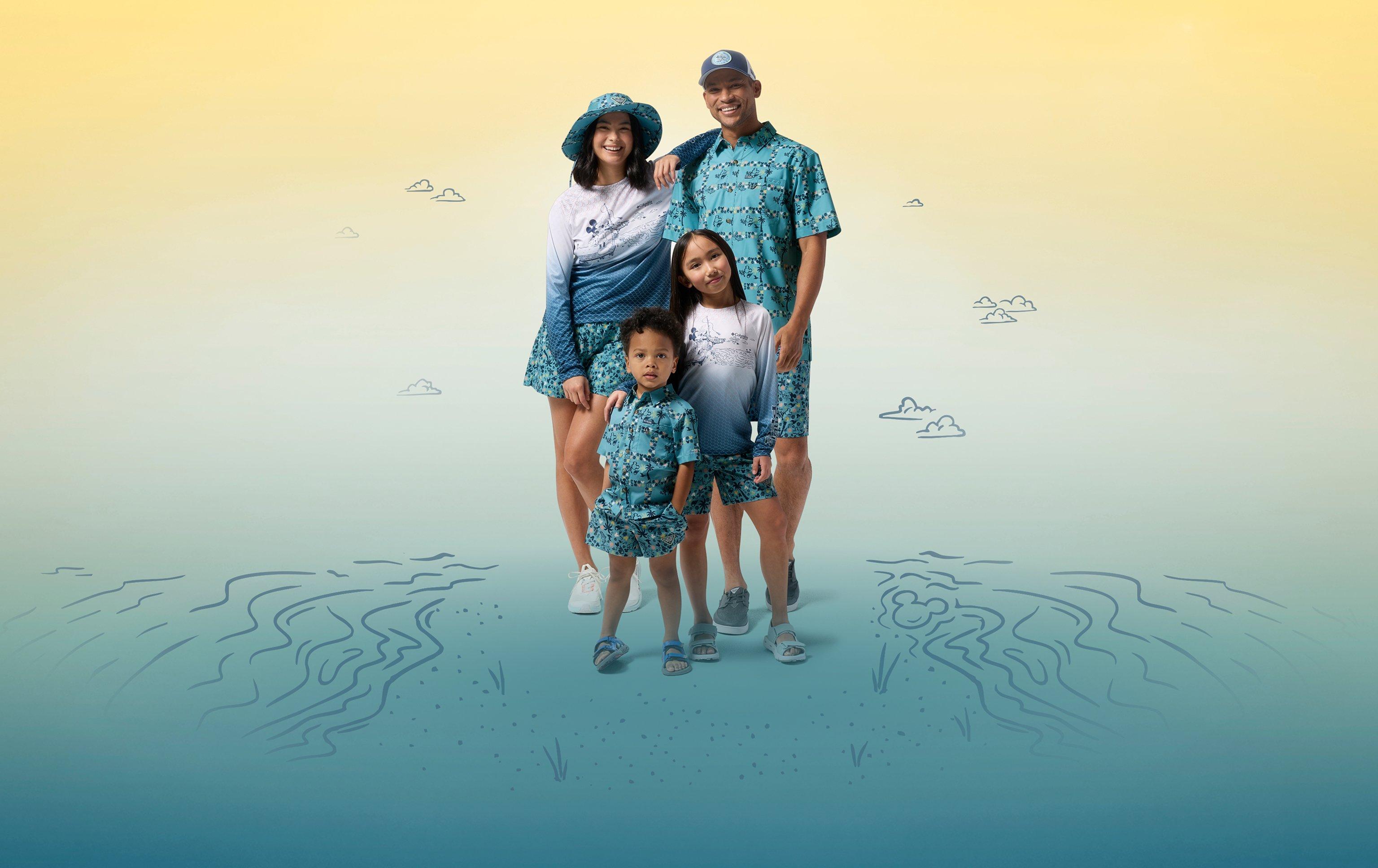 Family of four wearing coordinating turquoise patterned swimwear and resort clothing, posing together.