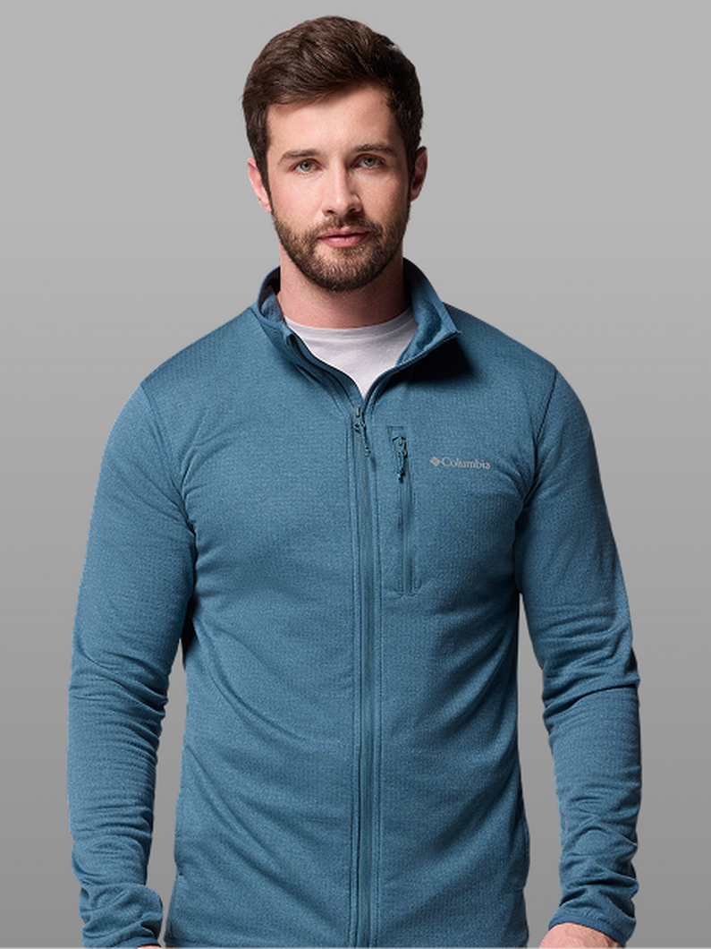 Man wearing a teal full-zip fleece jacket with chest pocket over a white t-shirt.