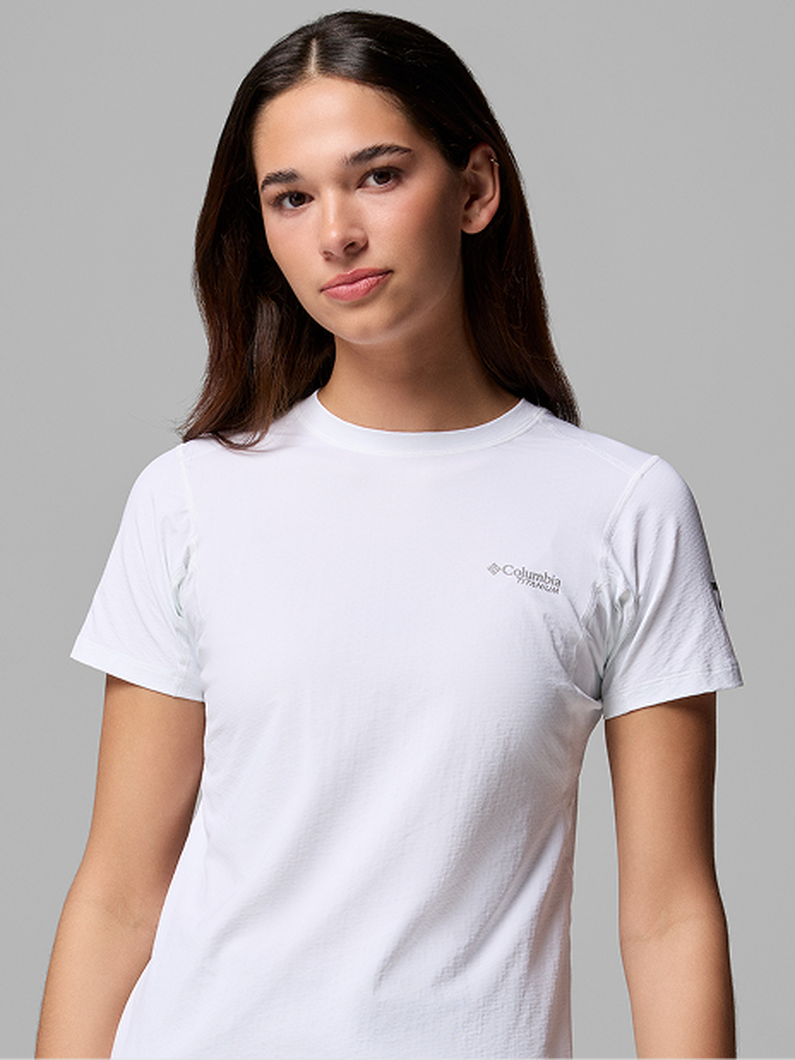 Woman wearing a white crew neck short-sleeve t-shirt with subtle texture.