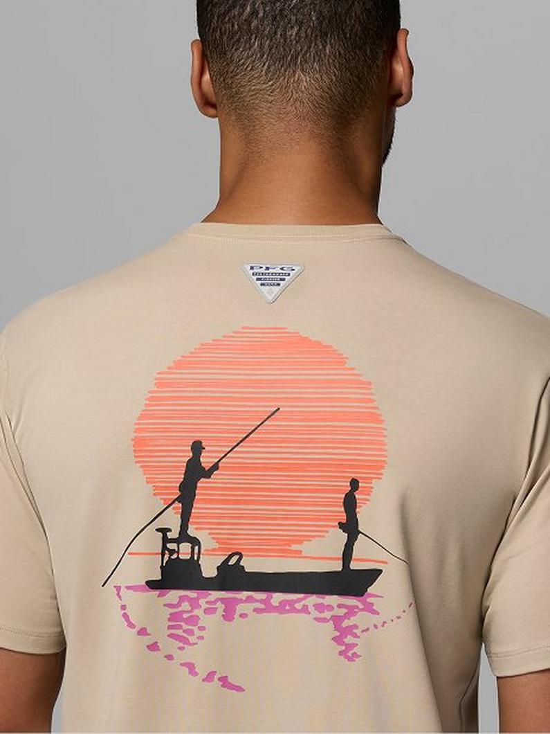 Back view of beige t-shirt featuring two people fishing from a boat against a striped sunset graphic.