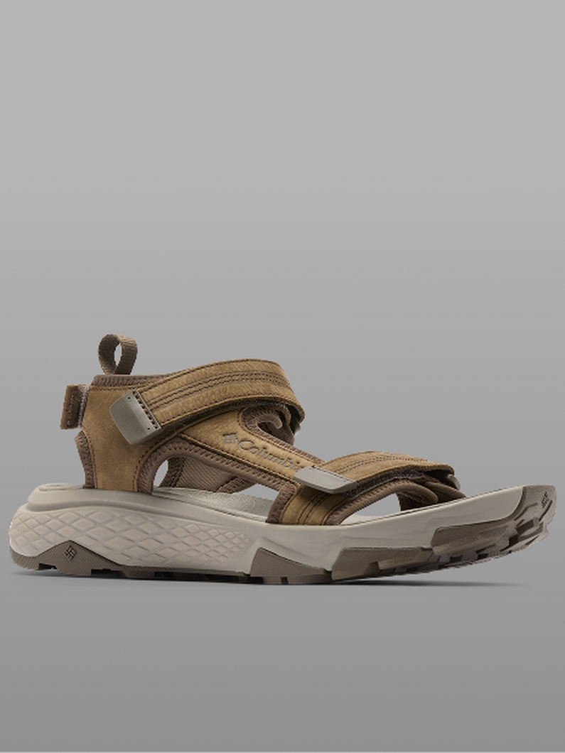 Brown and tan athletic sandal with adjustable straps and chunky treaded sole shown in side profile.