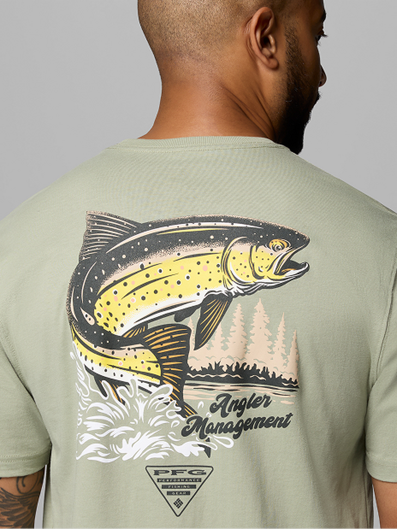 Back view of man wearing light green t-shirt featuring graphic of leaping trout with text "Angler Management."