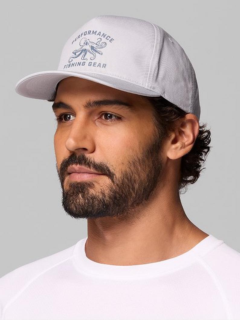 Man wearing a light gray snapback cap with Performance Fishing Gear text and octopus graphic on front.