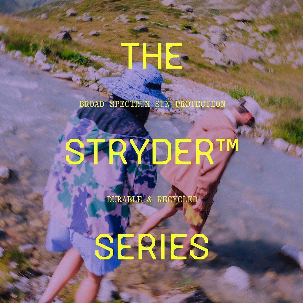 "The Stryder™ Series: Broad Spectrum Sun Protection, durable & recycled" type overlaid on an image of hikers exploring a riverside.