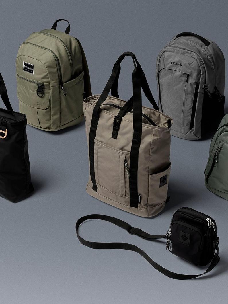 Commuter bags lined up against a grey backdrop.