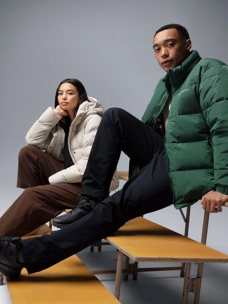 Two students sitting on bleachers.
