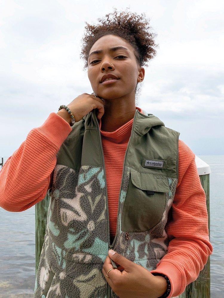 Women in fishing vest.