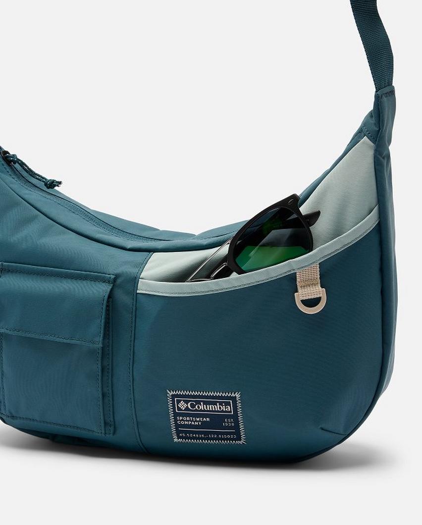 An image of a model wearing a small crossbody bag.