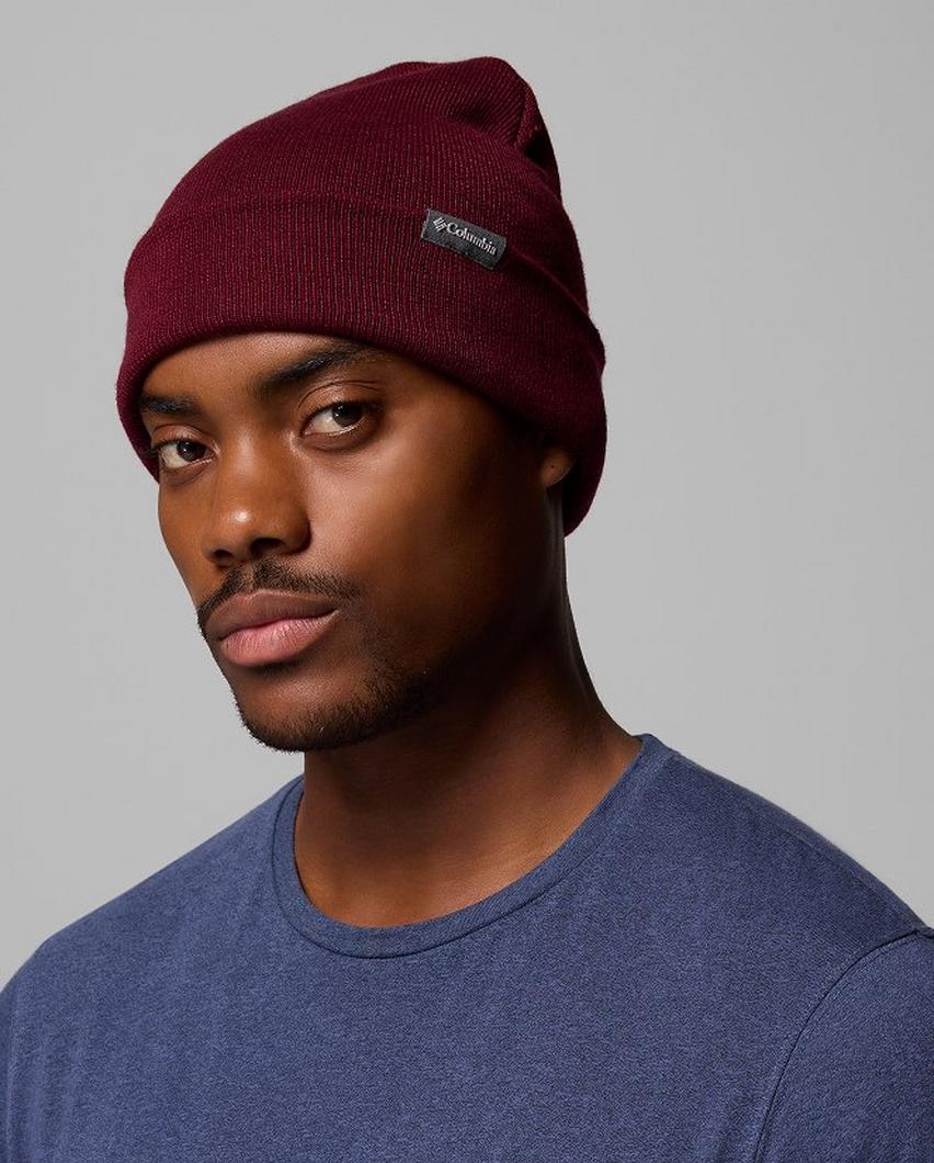 A man wearing a maroon beanie.