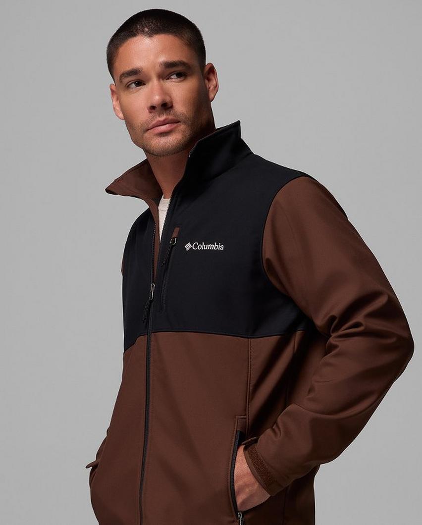 A man wearing a brown softshell jacket.