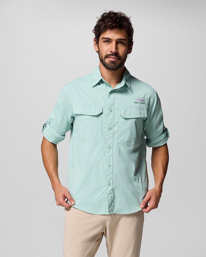 A man wearing a blue PFG button-up.