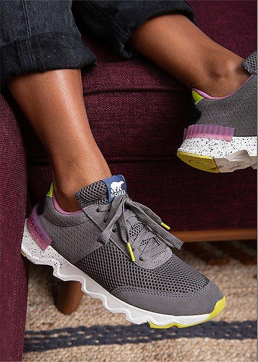 A close up of Candace Reels wearing Kinetic Lite Lace sneakers