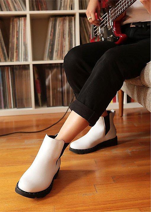 Barbie Bertischwearing Lennox Chelsea booties in an urban setting