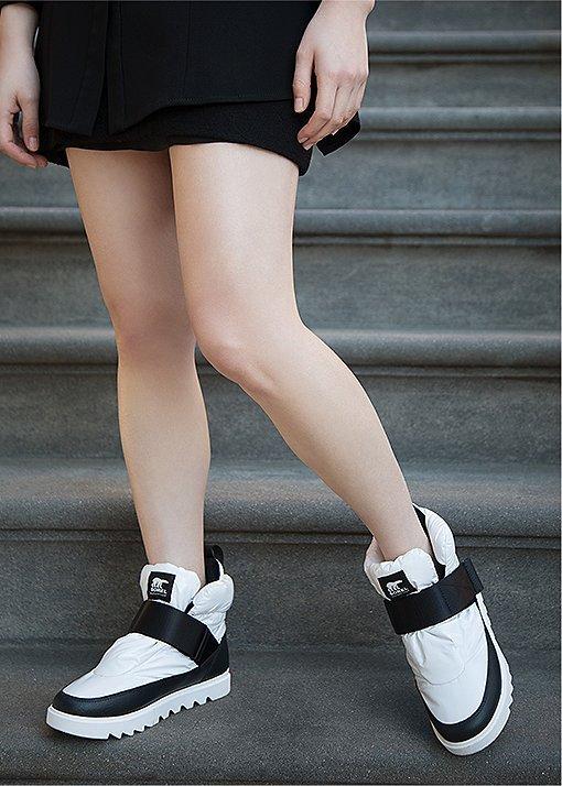 Image of Jessica Wu wearing Joan Next Lite Puffy boots in an urban setting