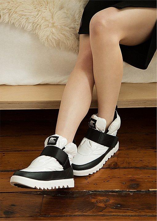 Image of Jessica Wu wearing Joan Next Lite Puffy boots in an urban setting