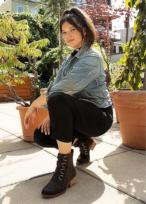 Natasha Pickowicz wearing Cate Lace booties in an urban setting