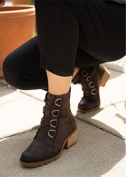 Natasha Pickowicz wearing Cate Lace booties in an urban setting