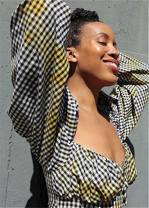 Marjon Carlos wearing Lennox Lace booties in an urban setting