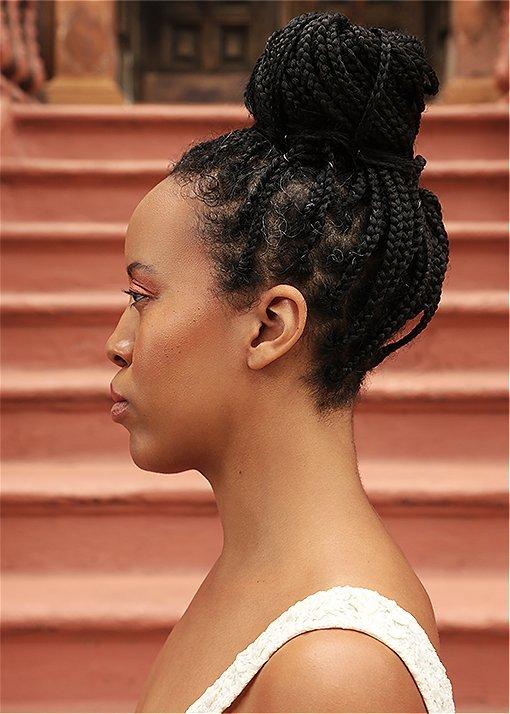 Portrait of Marjon Carlos wearing Lennox Lace booties in an urban setting