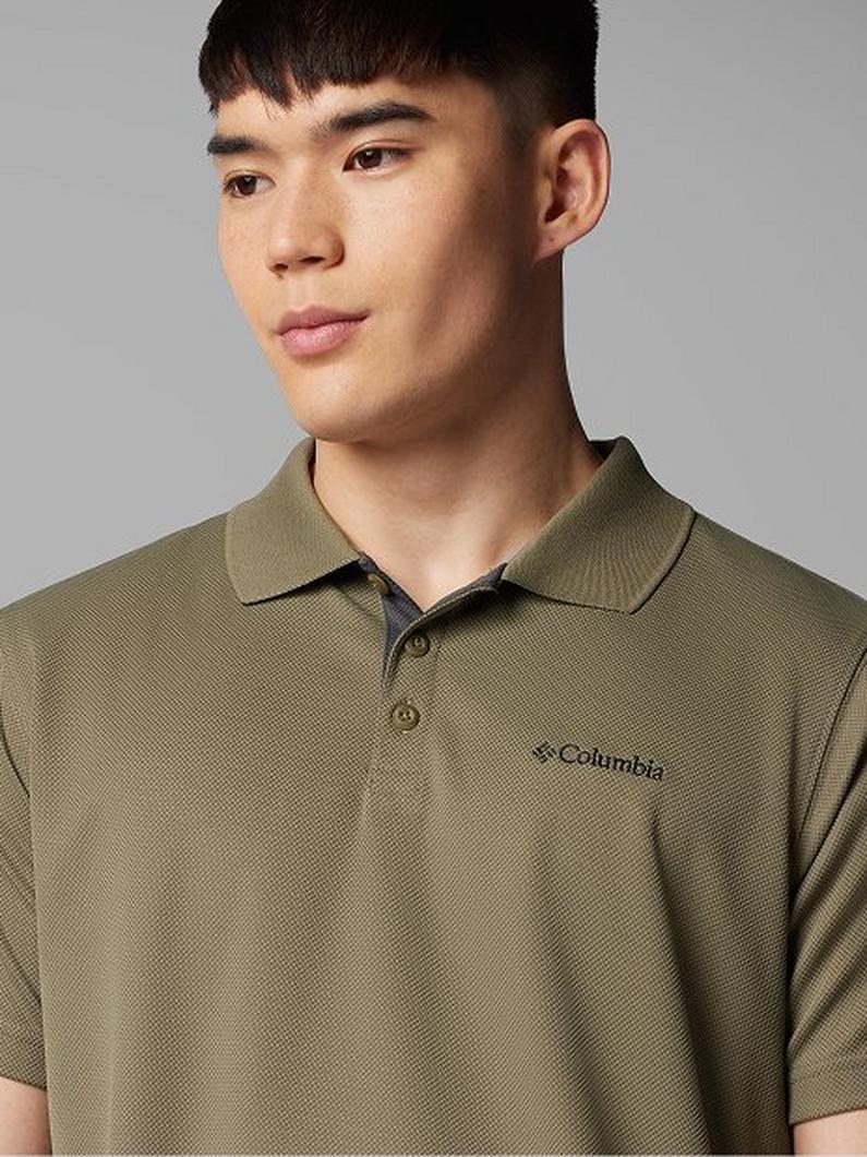 Man wearing an olive green short-sleeved polo shirt with collar and button placket.