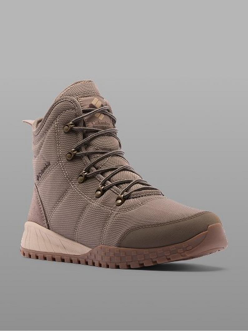Taupe lace-up hiking boot with textured upper and ridged sole.