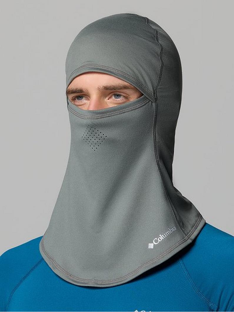 Gray balaclava face mask with eye opening and ventilation holes worn by a person in a blue shirt.