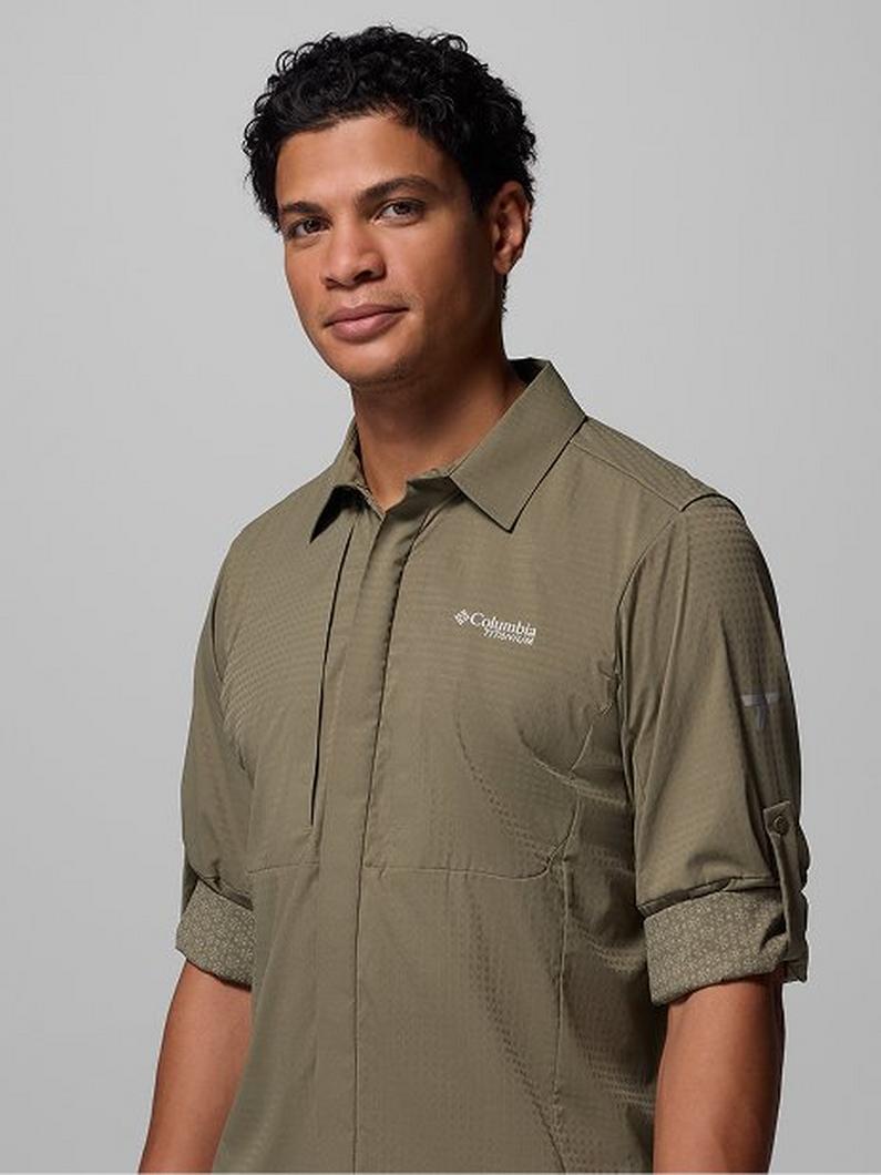 Man wearing olive green collared shirt with roll-up sleeves and chest pocket.