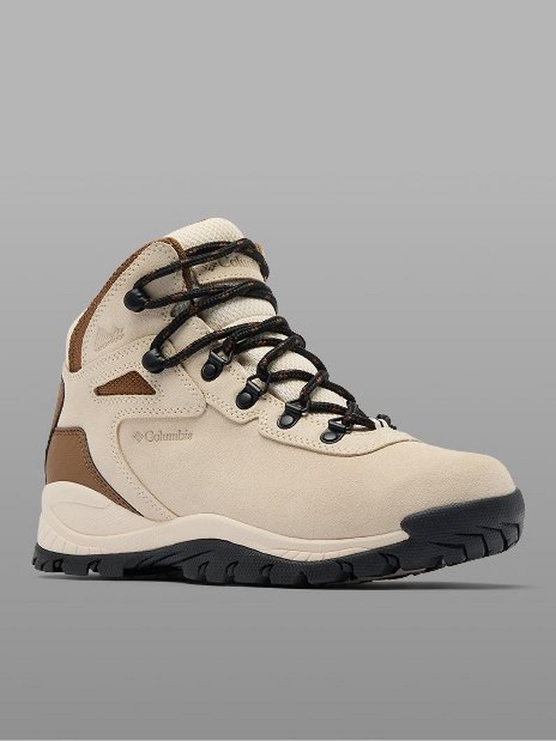 Beige hiking boot with brown accents, black laces, and black rubber sole shown in profile view.