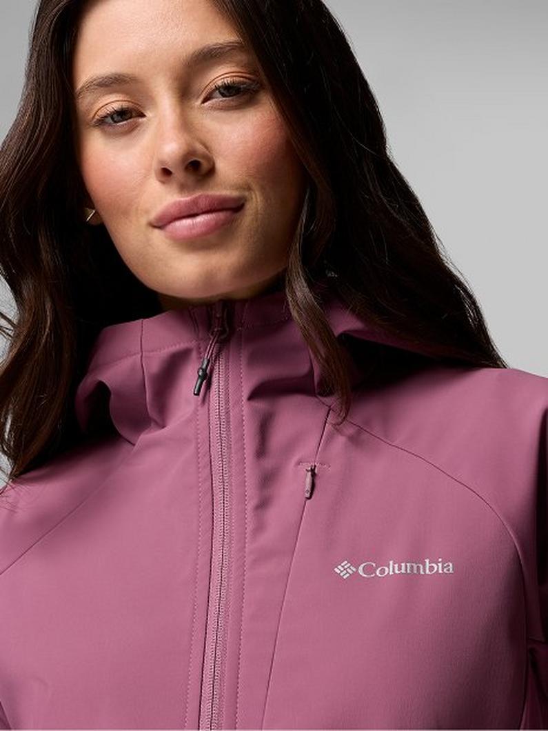 Woman wearing a mauve zip-up jacket with high collar and chest pocket.